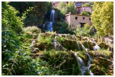 Waterfall falling from the centre of the town of Orbaneja del Castillo